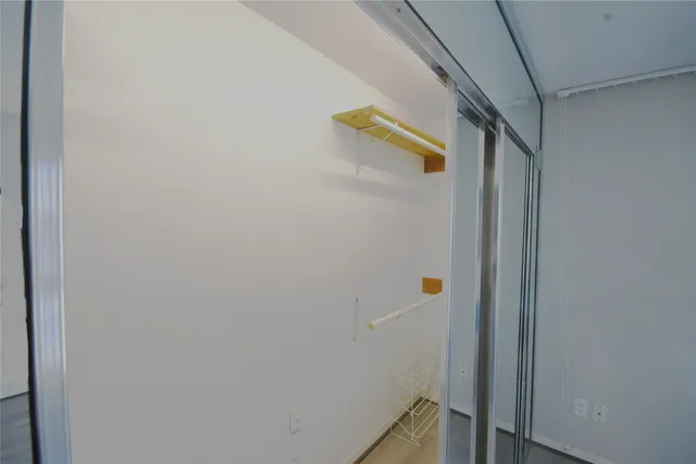 a view of a room with large windows