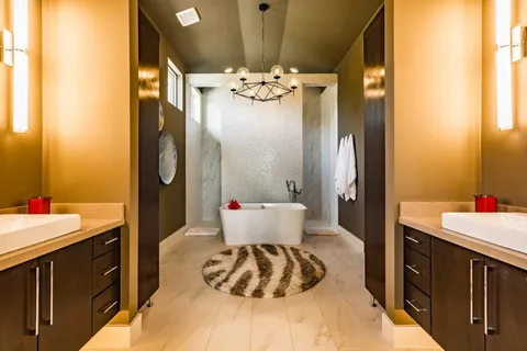 a bathroom with a sink vanity granite and a mirror