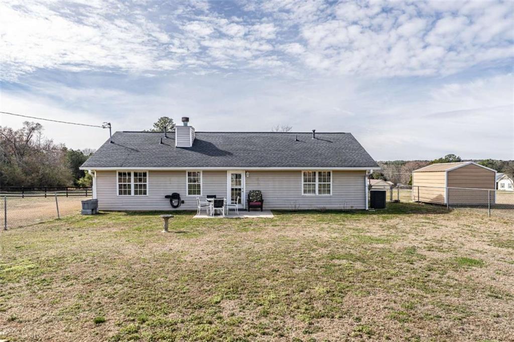 179 Couey Circle Northeast Rome, GA 30161 - Photo 27 of 37 a house that has a big yard and a large tree