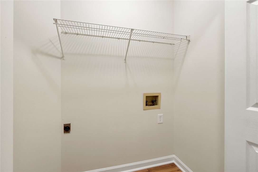 131 Lockaby Road Pelzer, SC 29669 - Photo 34 of 50 This dedicated laundry space offers convenience with practical shelving and all necessary hookups.