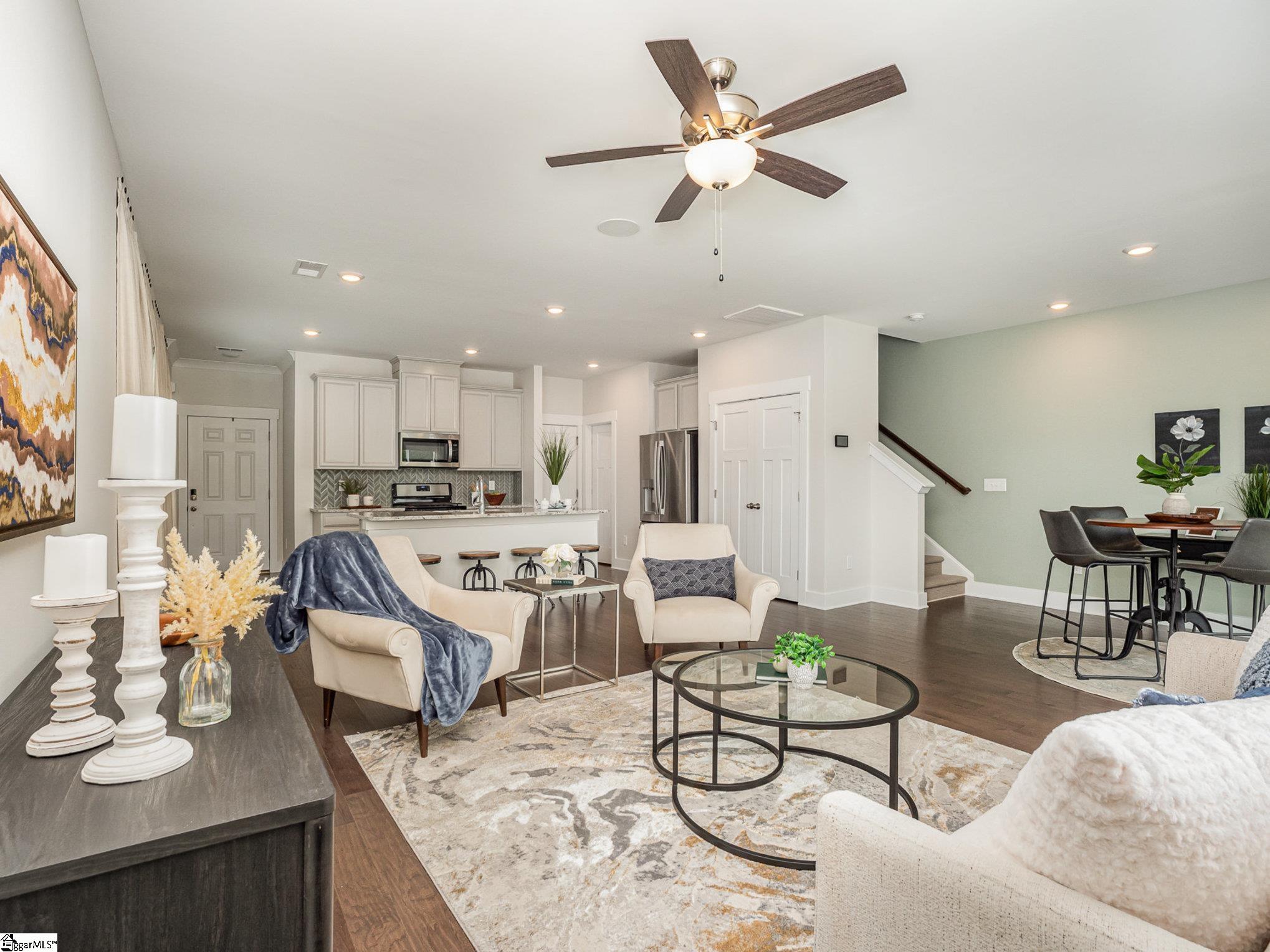 100 Outback Drive Greer, SC 29650 - Photo 3 of 25 Open living/dining/kitchen makes for lots of family and friend togetherness.
