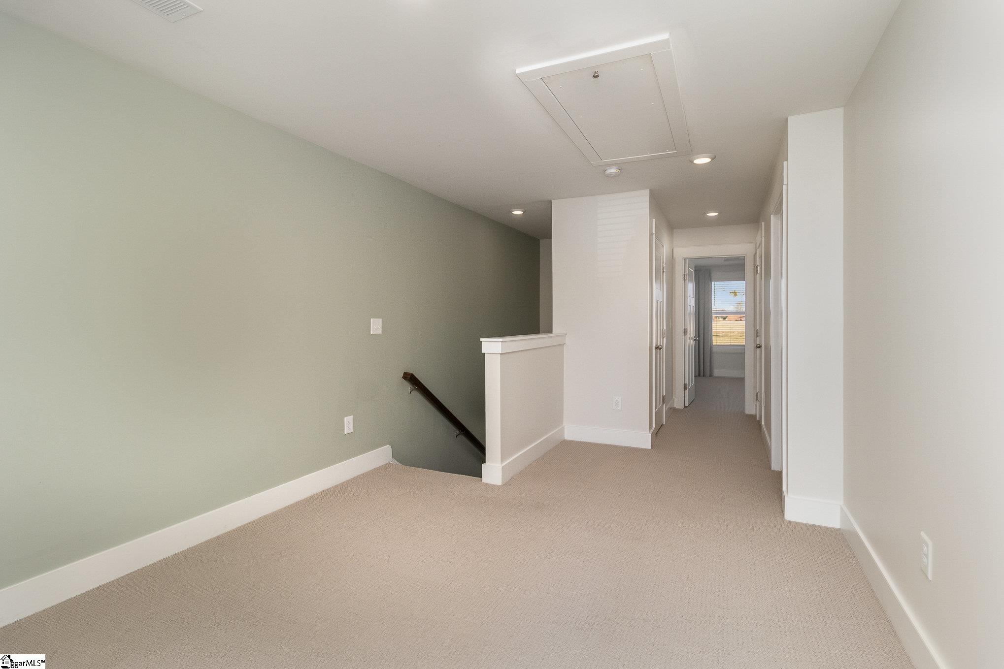100 Outback Drive Greer, SC 29650 - Photo 10 of 25 This loft space offers flexible use. A game room, a play room, an office, you name it, it's yours to fill and use.
