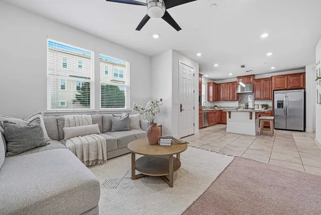a living room with furniture and a large window