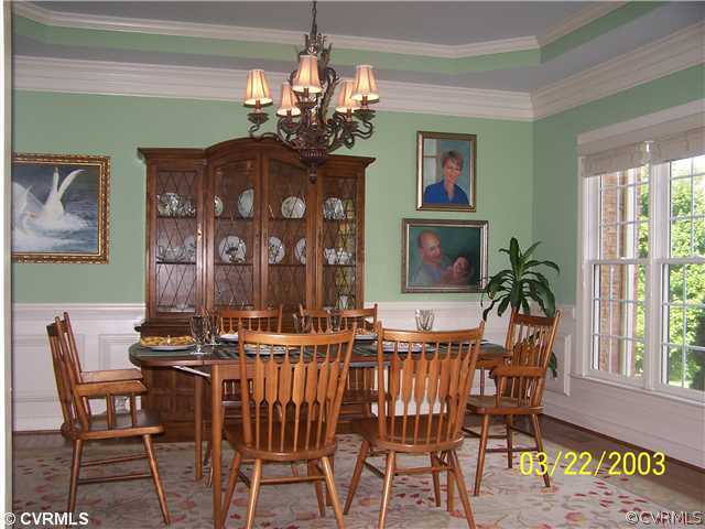13338 Tipple Point Road Midlothian, VA 23114 - Photo 3 of 12 a view of a dining room with furniture wooden floor and chandelier