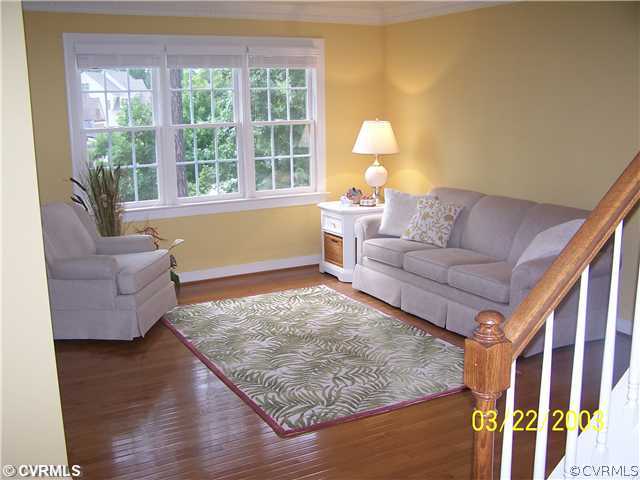 13338 Tipple Point Road Midlothian, VA 23114 - Photo 8 of 12 a living room with furniture and a large window