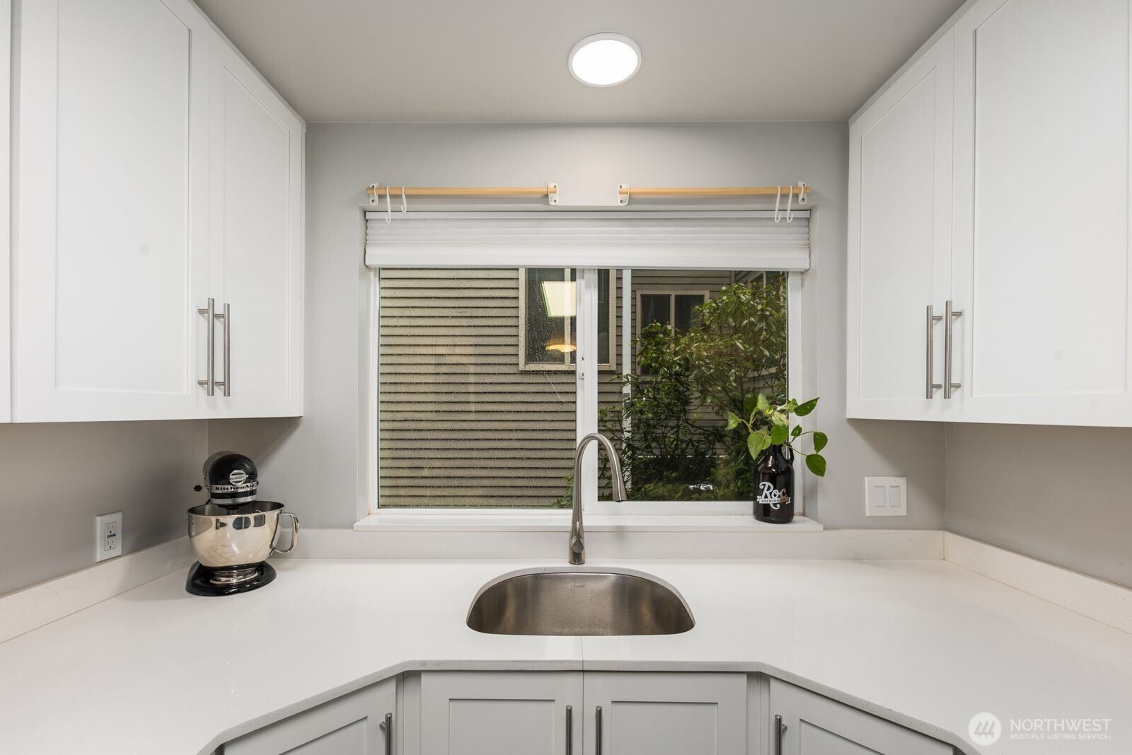 1729 18th Avenue, Unit 201 Seattle, WA 98122 - Photo 14 of 31 a kitchen with a sink and a potted plant