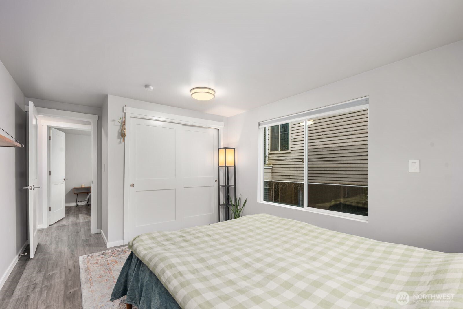 1729 18th Avenue, Unit 201 Seattle, WA 98122 - Photo 21 of 31 a bedroom with a bed and a large window