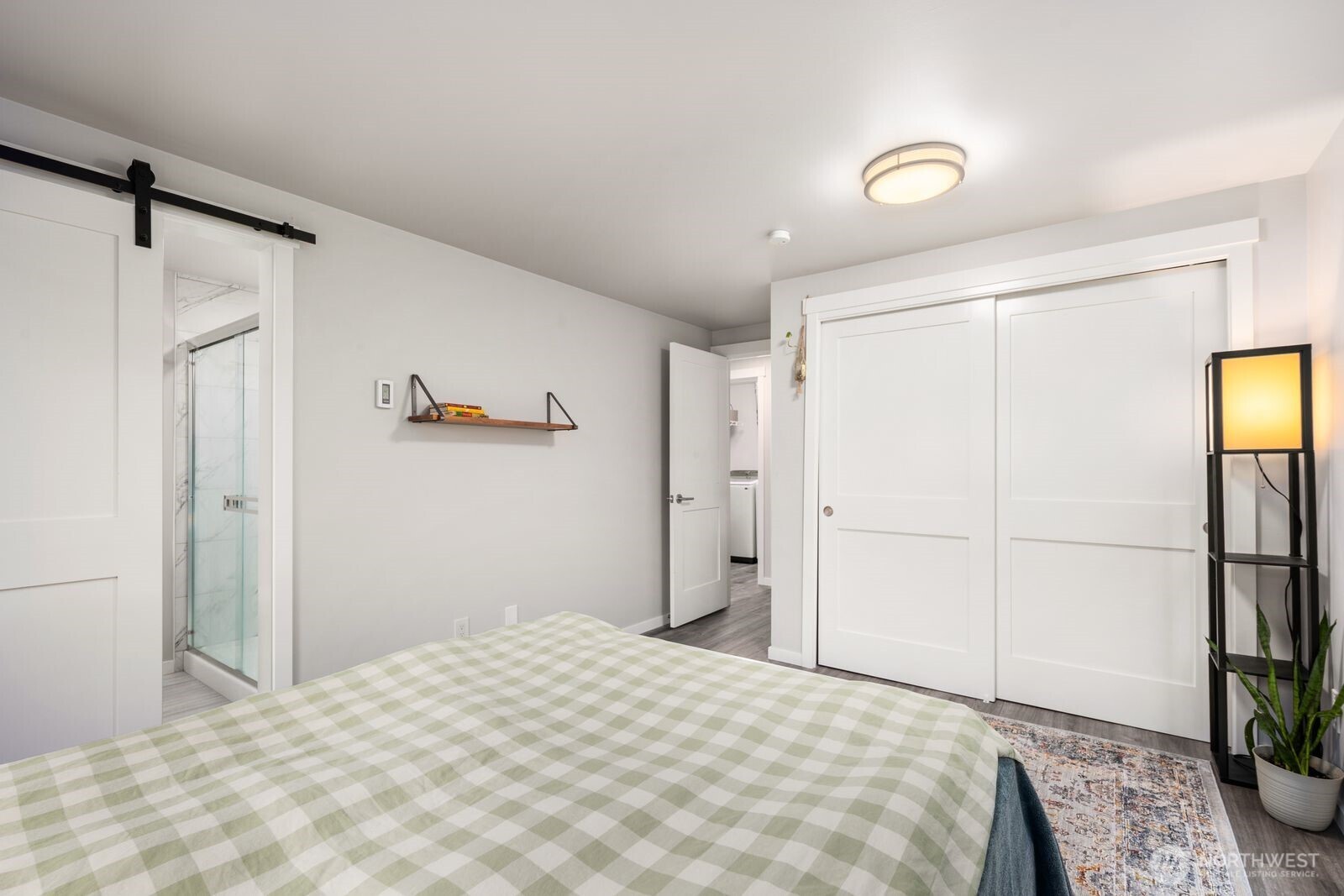 1729 18th Avenue, Unit 201 Seattle, WA 98122 - Photo 22 of 31 a bedroom with a bed and a flat screen tv