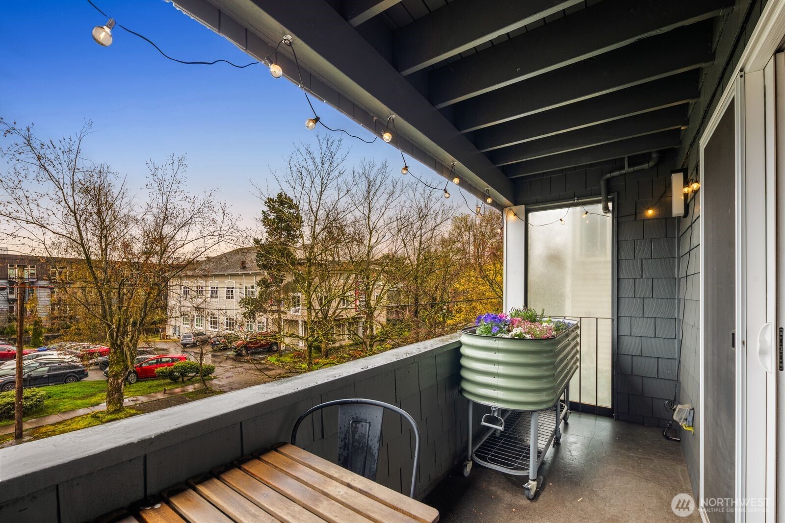 1729 18th Avenue, Unit 201 Seattle, WA 98122 - Photo 27 of 31 a balcony with chairs and a table