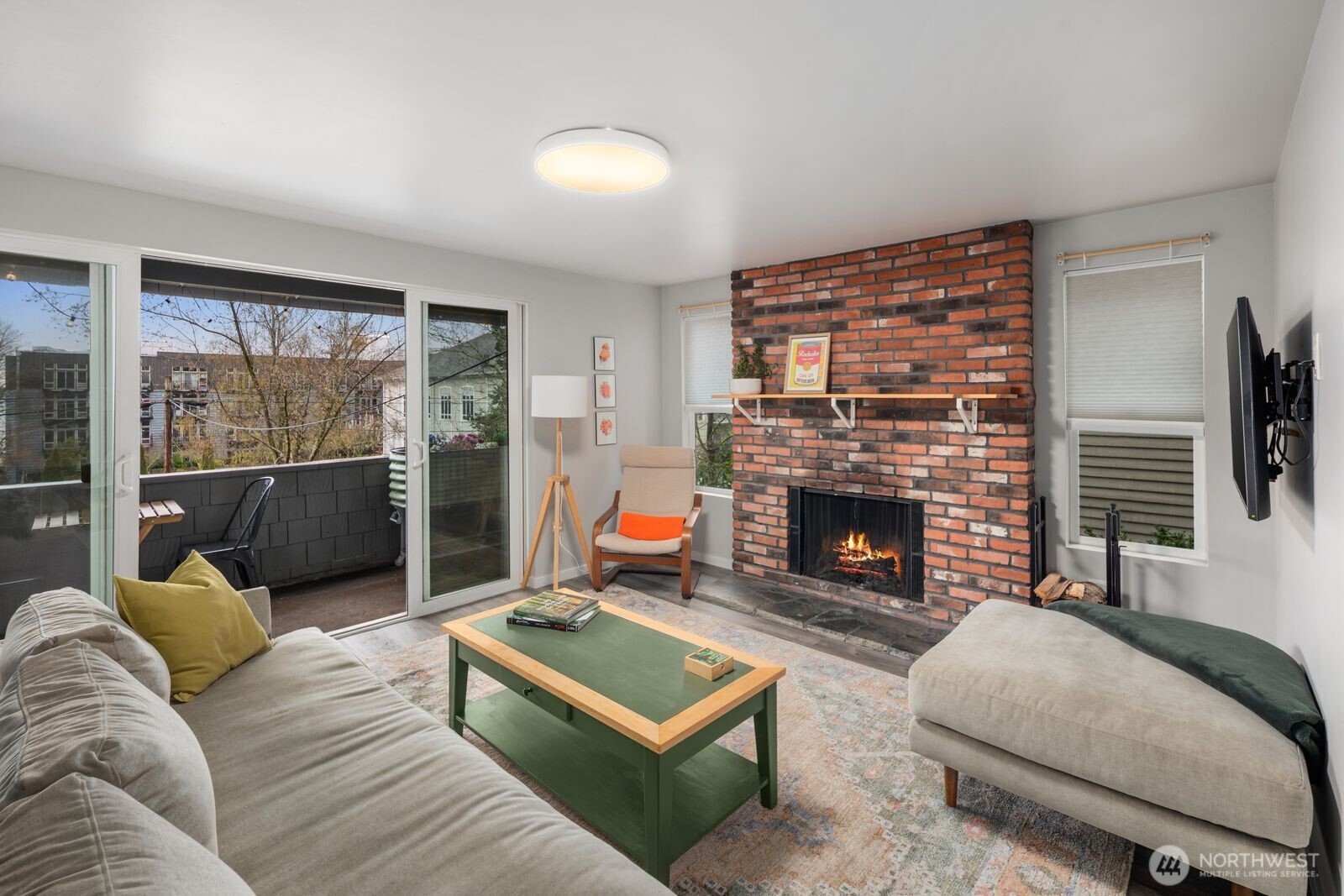 1729 18th Avenue, Unit 201 Seattle, WA 98122 - Photo 4 of 31 a living room with furniture and a fireplace