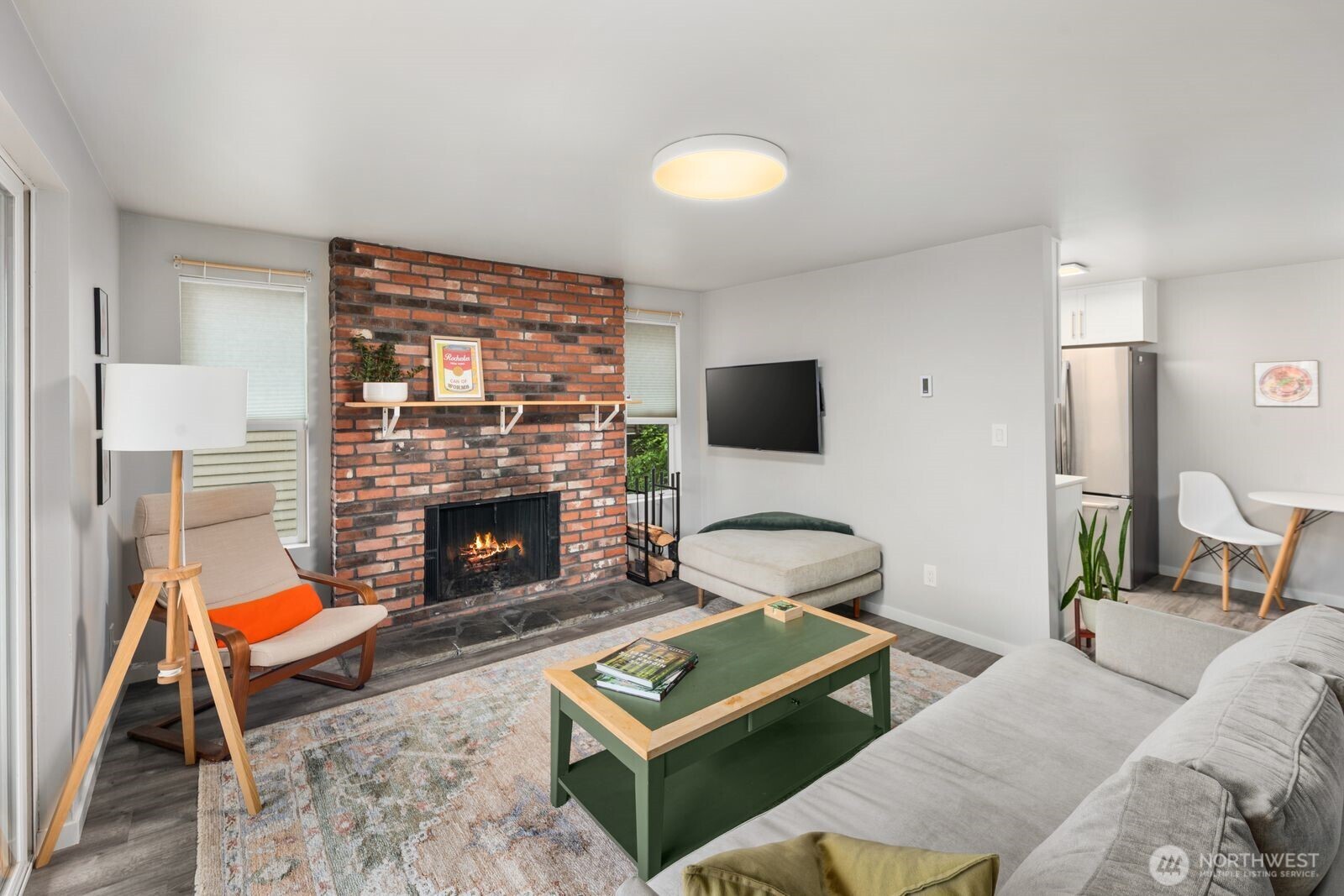 1729 18th Avenue, Unit 201 Seattle, WA 98122 - Photo 6 of 31 a living room with furniture and a fireplace