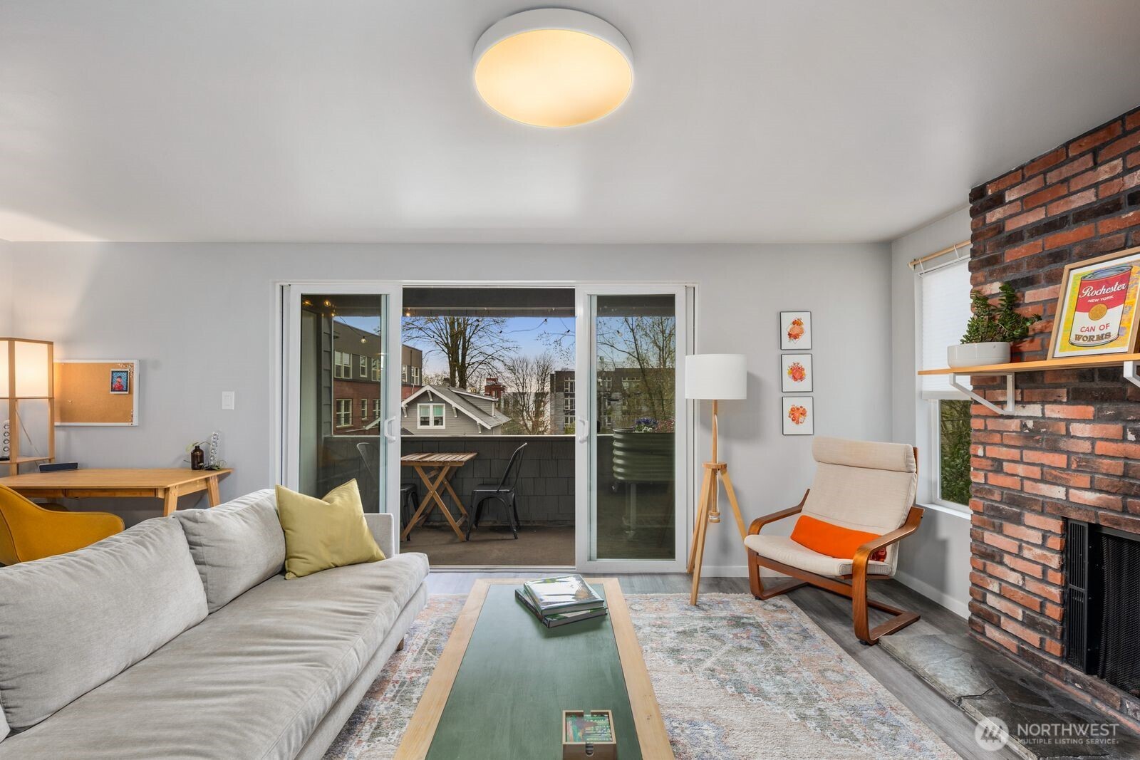 1729 18th Avenue, Unit 201 Seattle, WA 98122 - Photo 9 of 31 a living room with furniture a rug and a fireplace