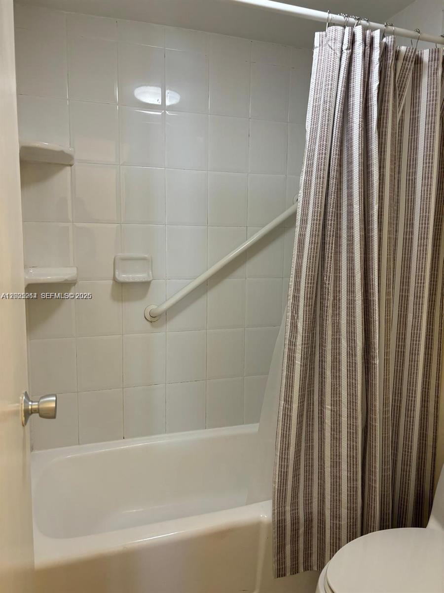 100 Lincoln Road, Unit 731 Miami Beach, FL 33139 - Photo 12 of 14 a bathroom with a bathtub and a shower