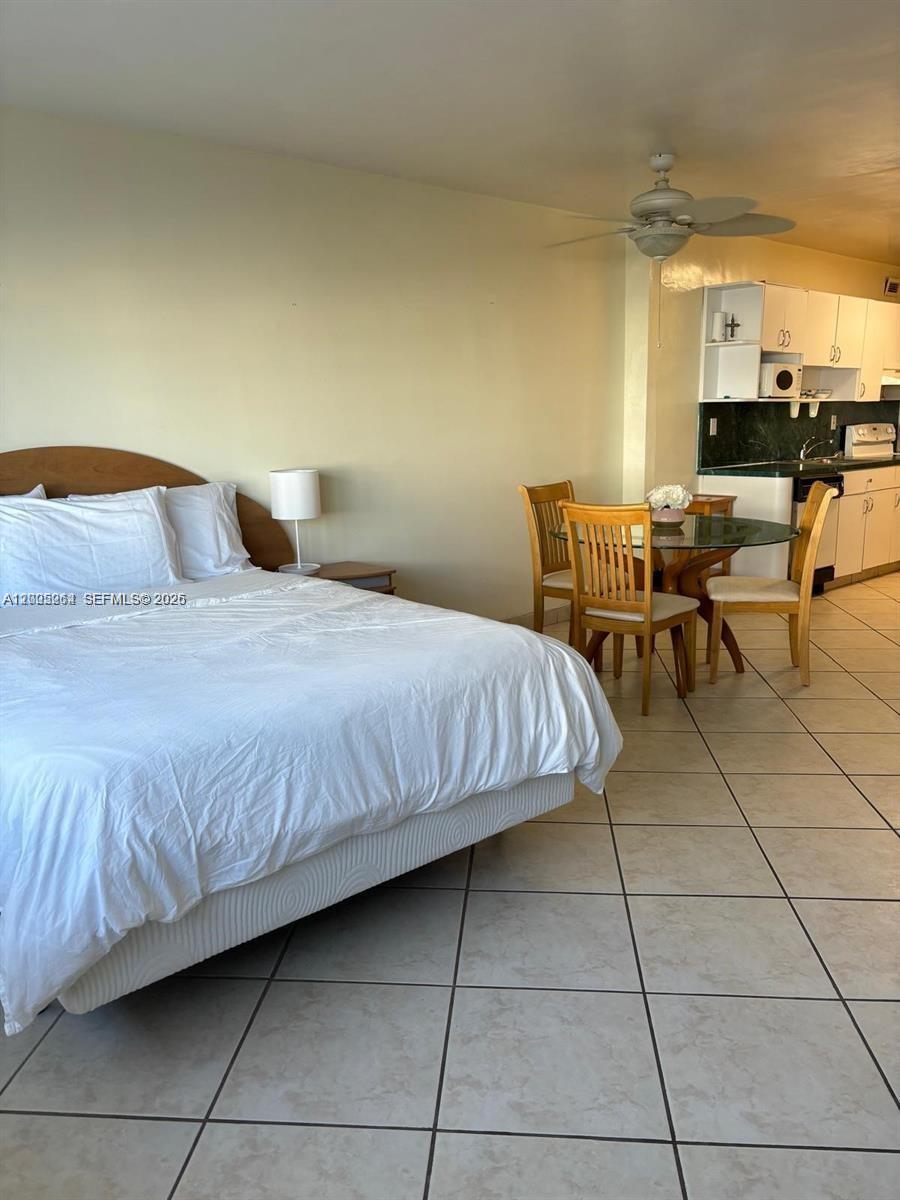 100 Lincoln Road, Unit 731 Miami Beach, FL 33139 - Photo 2 of 14 a bedroom with a bed a table and chair