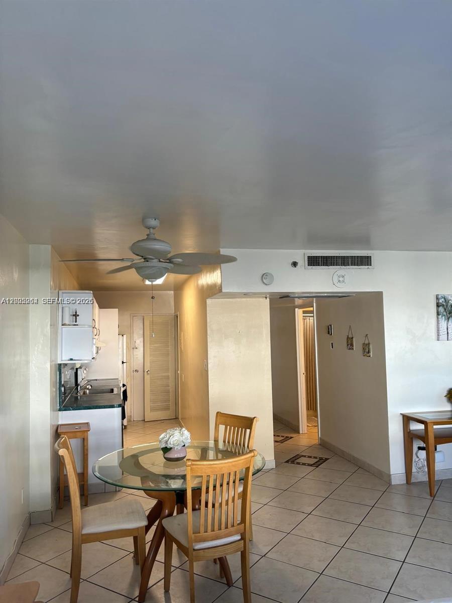 100 Lincoln Road, Unit 731 Miami Beach, FL 33139 - Photo 5 of 14 a dining room with furniture and window