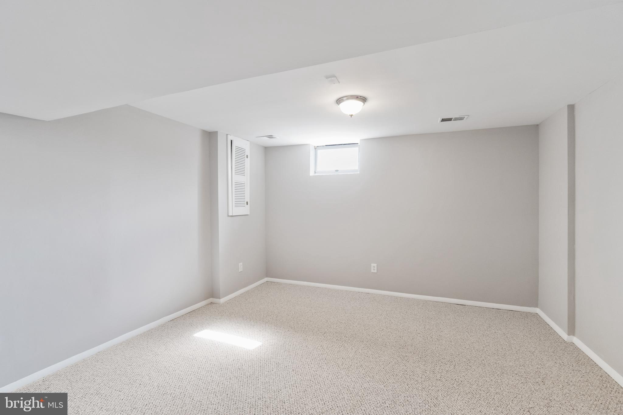 5750 Van Dyke Road Baltimore, MD 21206 - Photo 16 of 42 Large Downstairs bedroom
