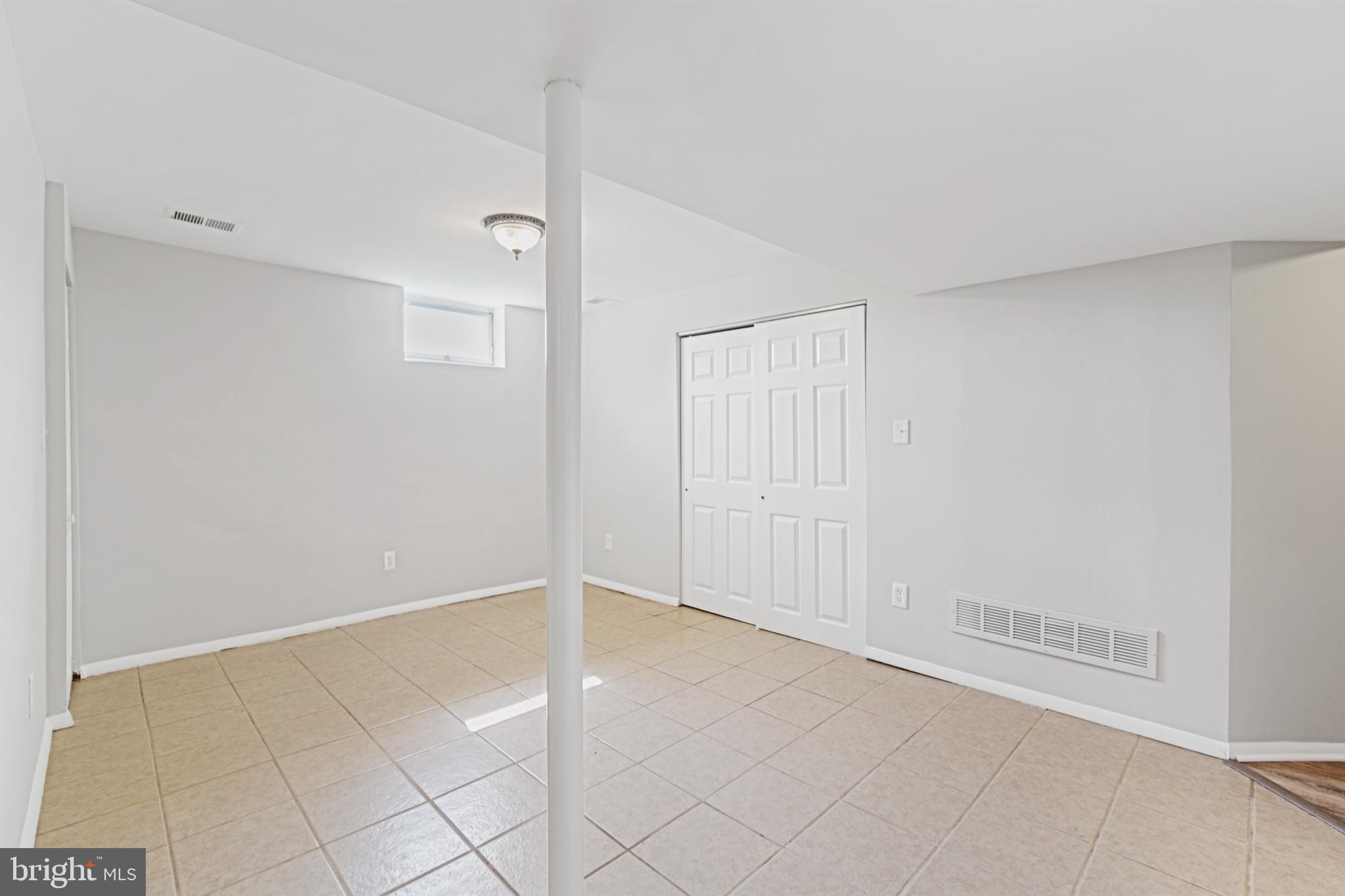 5750 Van Dyke Road Baltimore, MD 21206 - Photo 19 of 42 Downstairs family room has ceramic tile floors