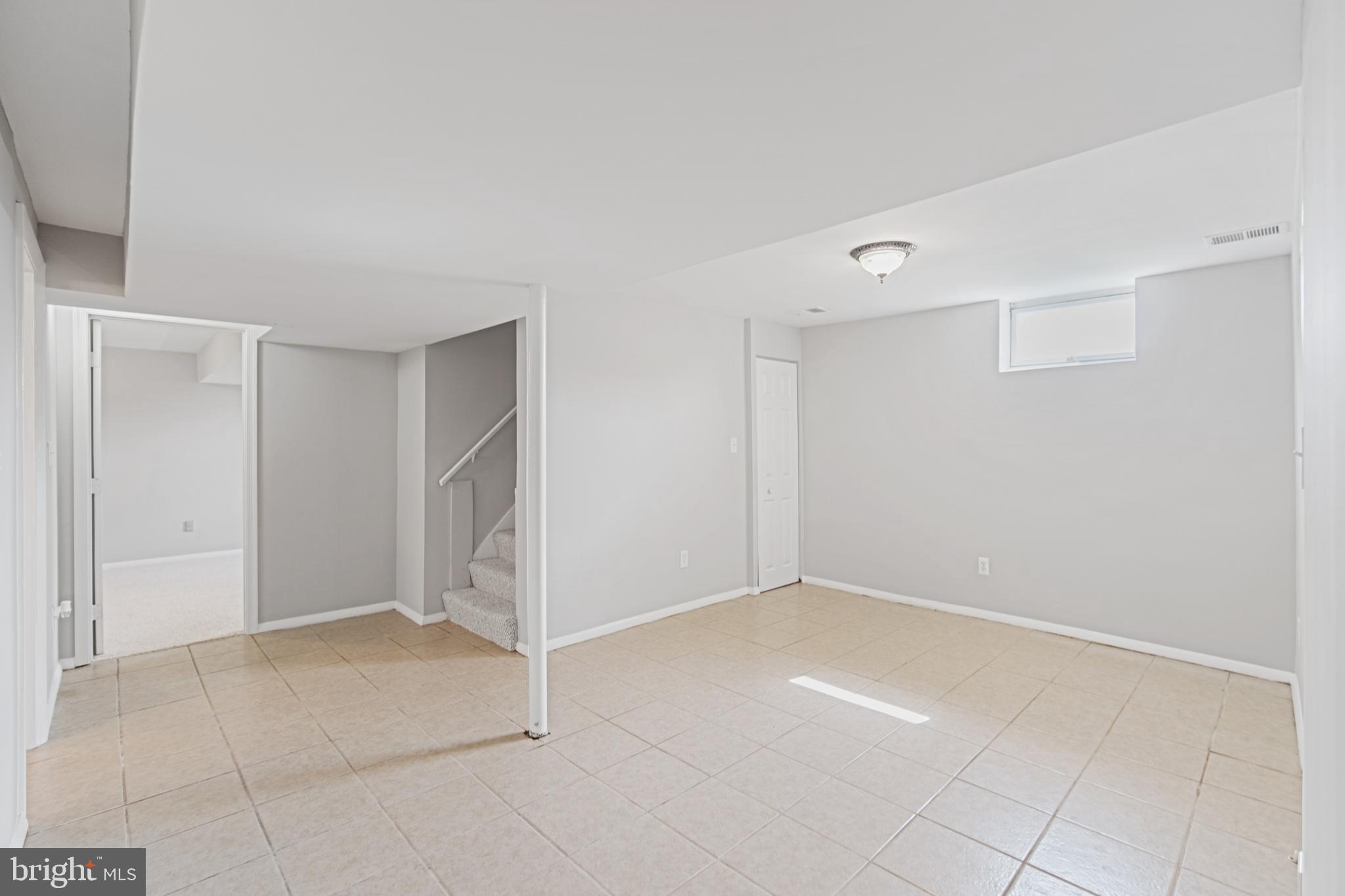 5750 Van Dyke Road Baltimore, MD 21206 - Photo 20 of 42 Downstairs Family Room, ceramic floor, fresh paint