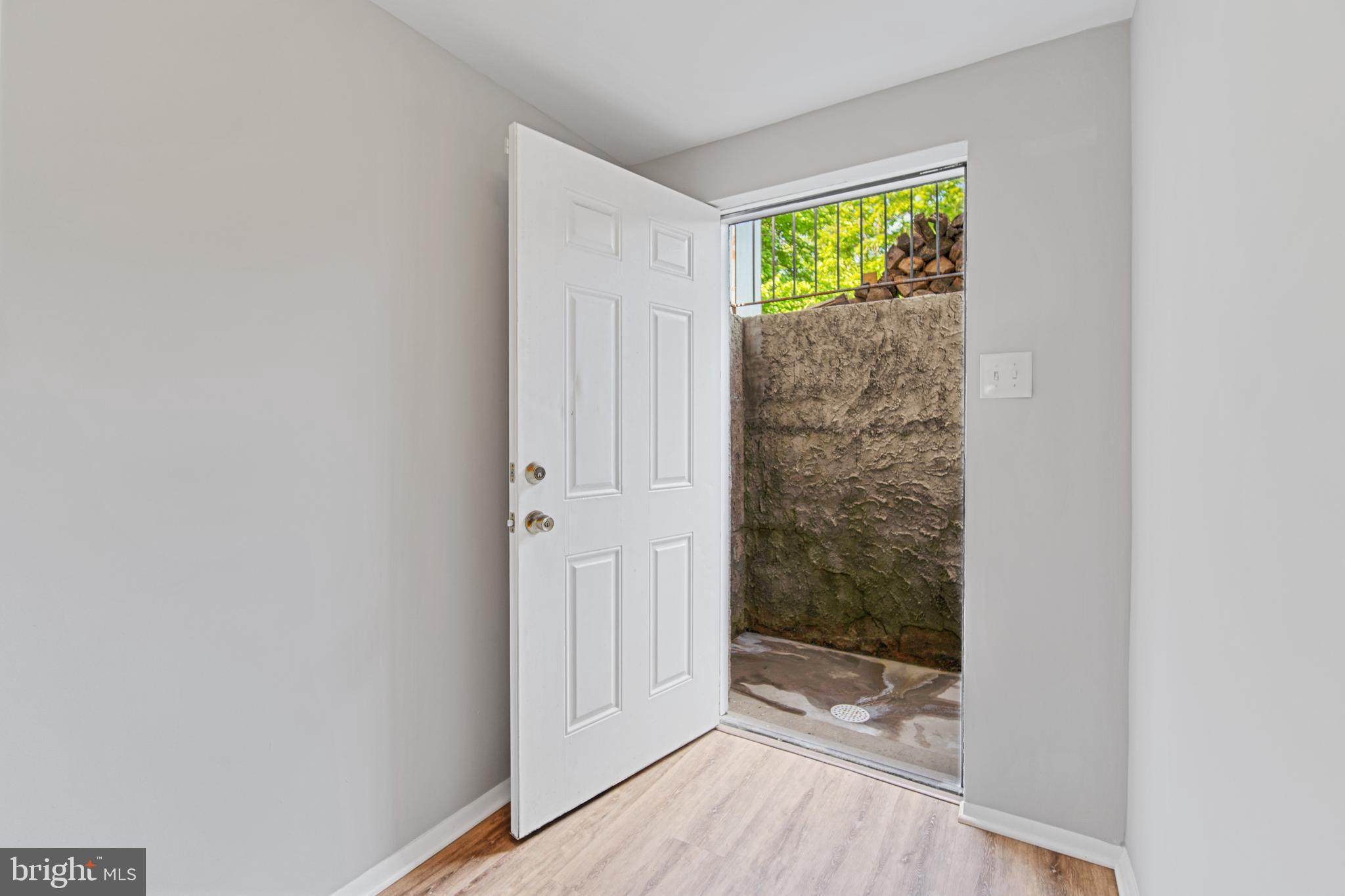 5750 Van Dyke Road Baltimore, MD 21206 - Photo 23 of 42 Exterior basement door, stairwell to back yard
