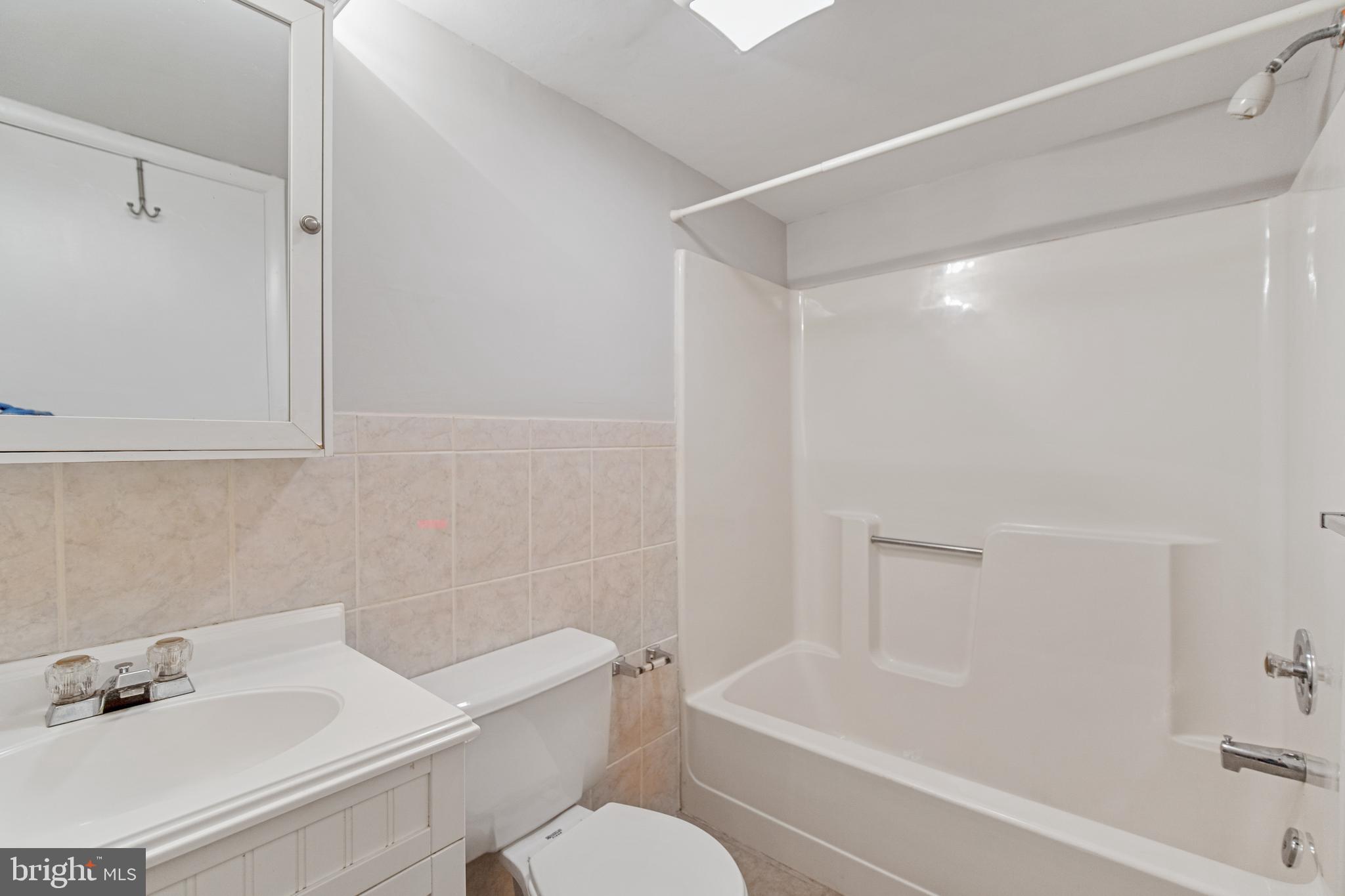 5750 Van Dyke Road Baltimore, MD 21206 - Photo 24 of 42 Full bath downstairs with tub/shower combination