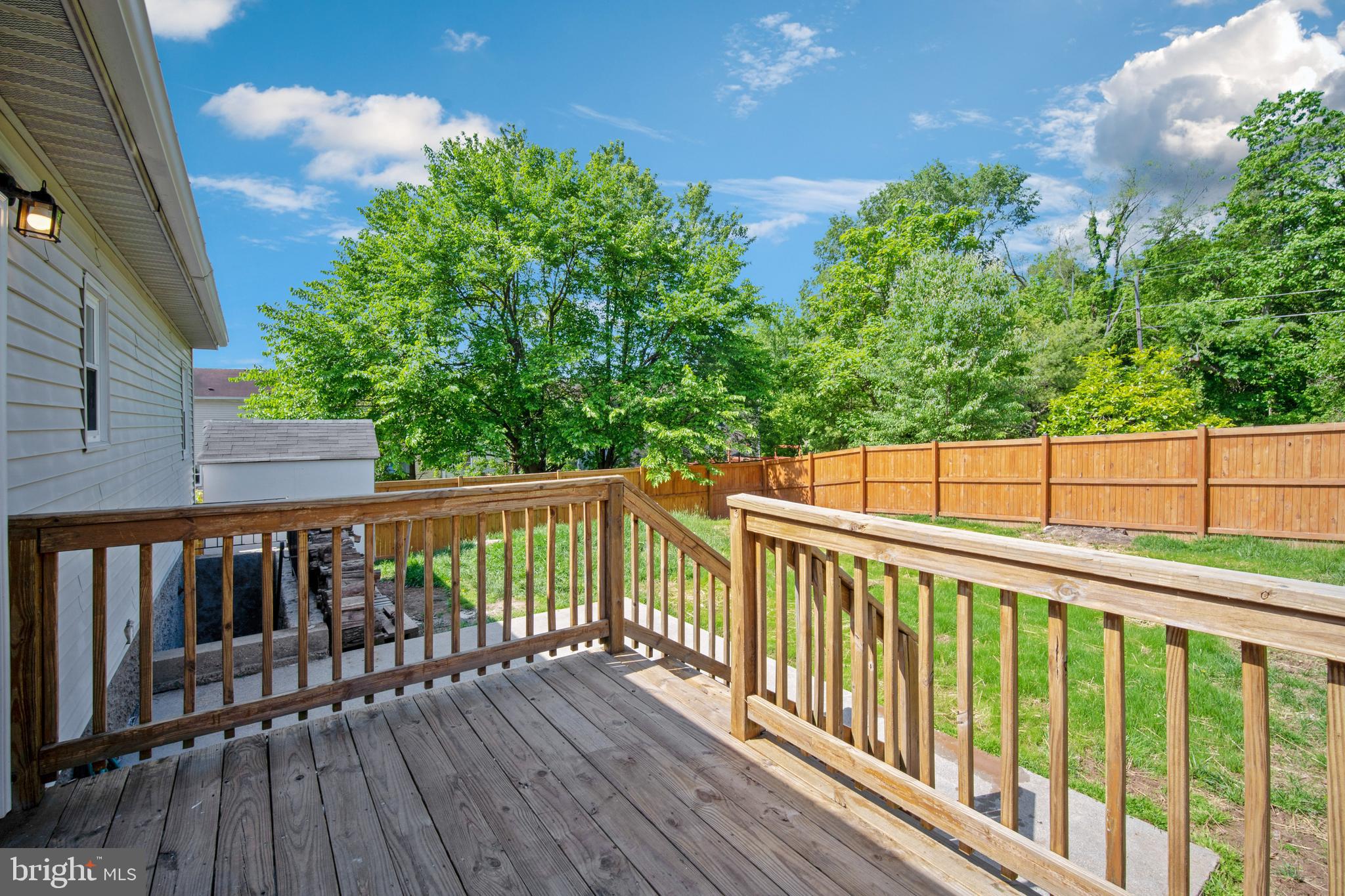 5750 Van Dyke Road Baltimore, MD 21206 - Photo 26 of 42 Back deck/ patio and fenced rear yard