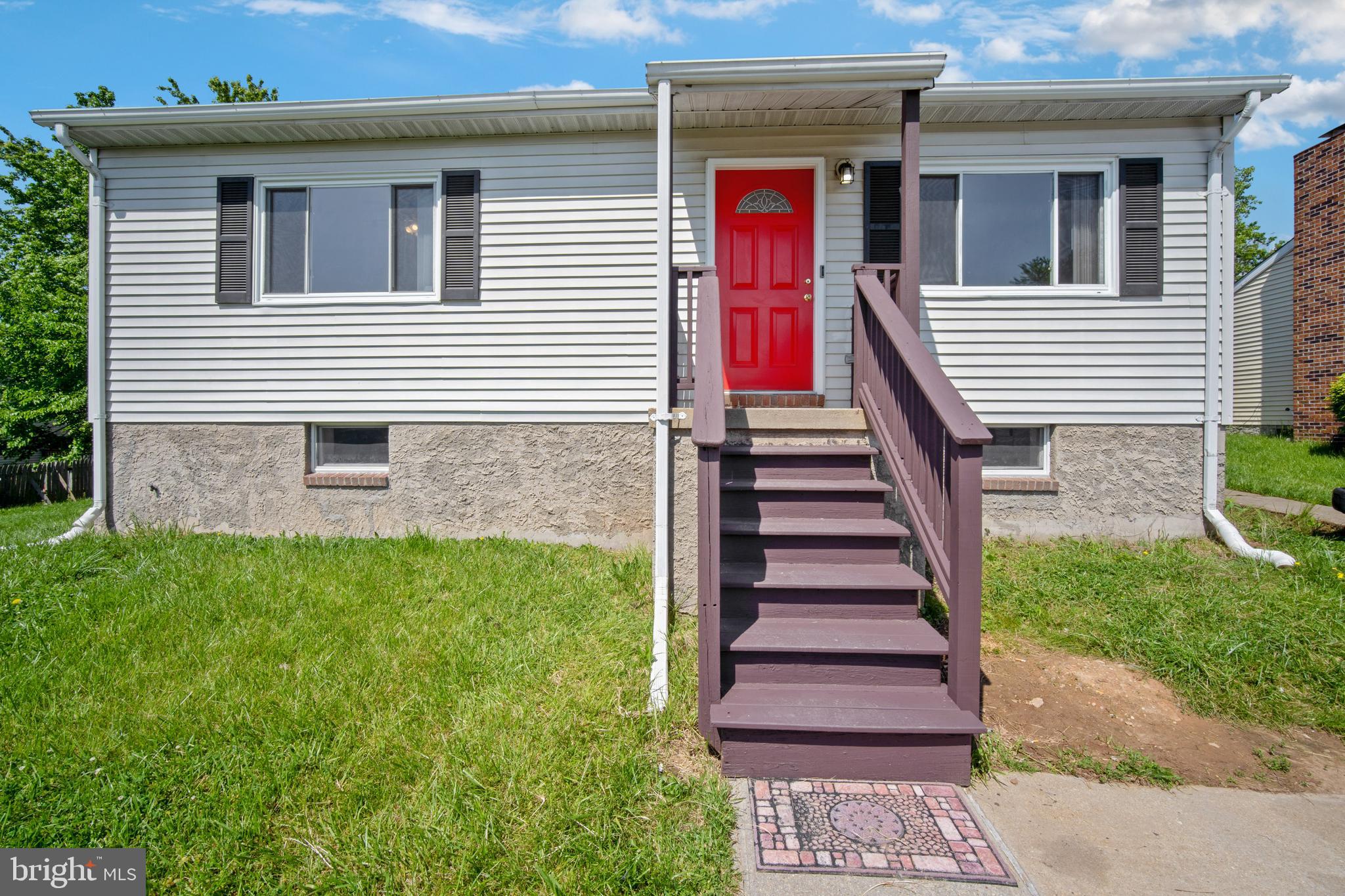 5750 Van Dyke Road Baltimore, MD 21206 - Photo 30 of 42 Front of house, shuttered windows, bright red door
