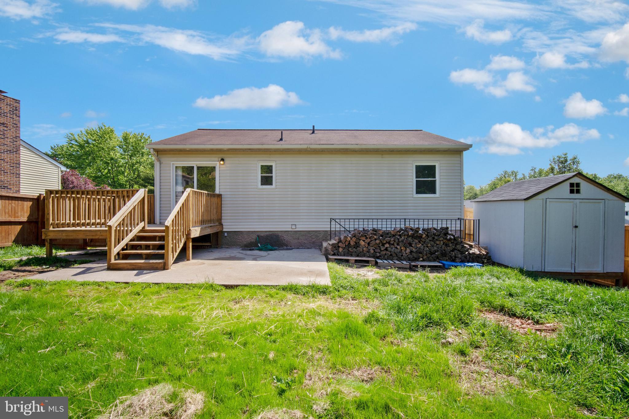 5750 Van Dyke Road Baltimore, MD 21206 - Photo 37 of 42 Back yard with concrete patio & ample deck space