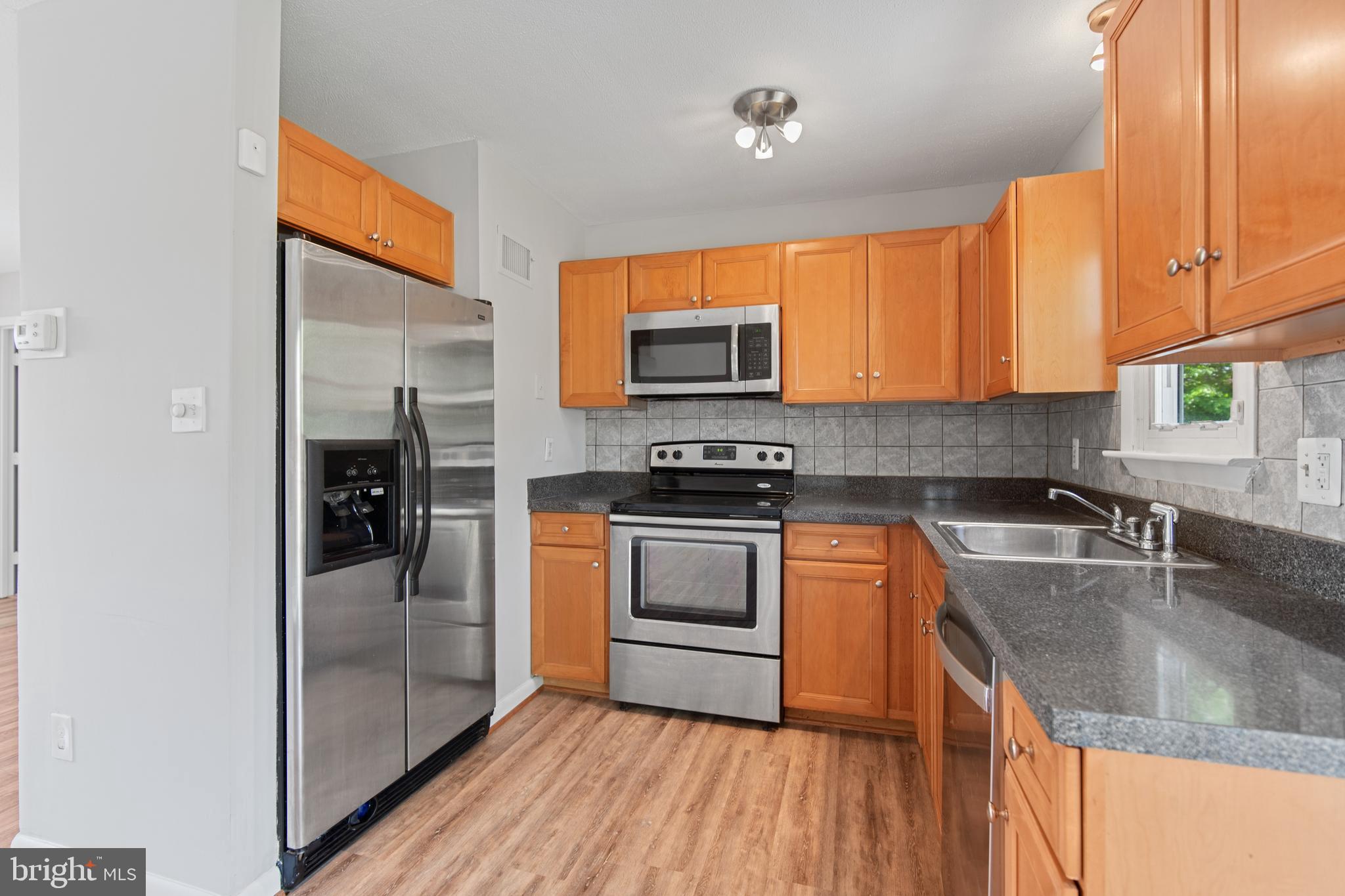 5750 Van Dyke Road Baltimore, MD 21206 - Photo 4 of 42 Kitchen with ceramic tile back splash
