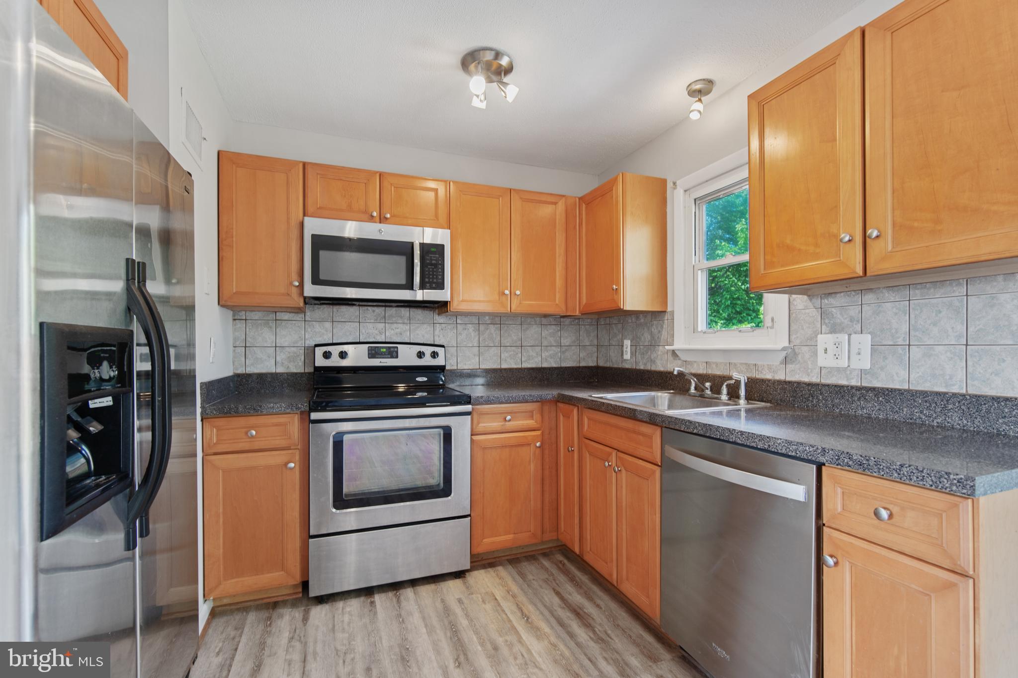 5750 Van Dyke Road Baltimore, MD 21206 - Photo 7 of 42 built in microwave and refrigerator with ice maker