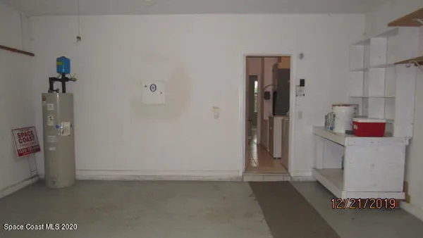 a view of hallway with cabinets