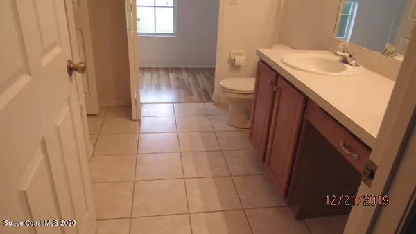a bathroom with a sink a toilet and tub