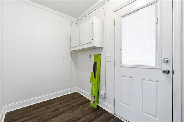 a view of an entryway with wooden floor