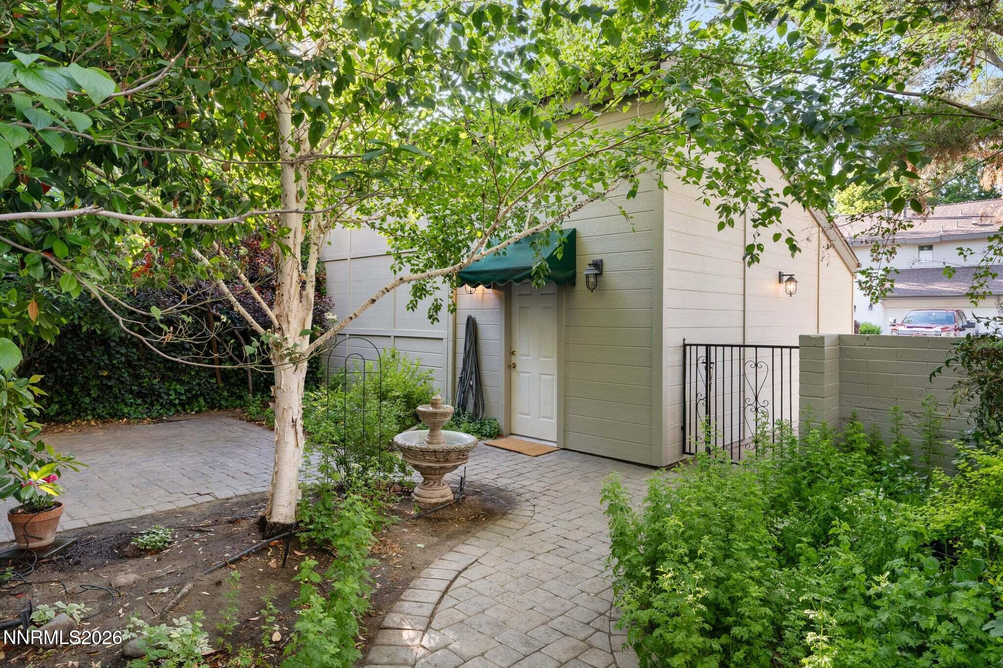 430 Angela Place Reno, NV 89509 - Photo 6 of 48 a white house that has tree in front of it
