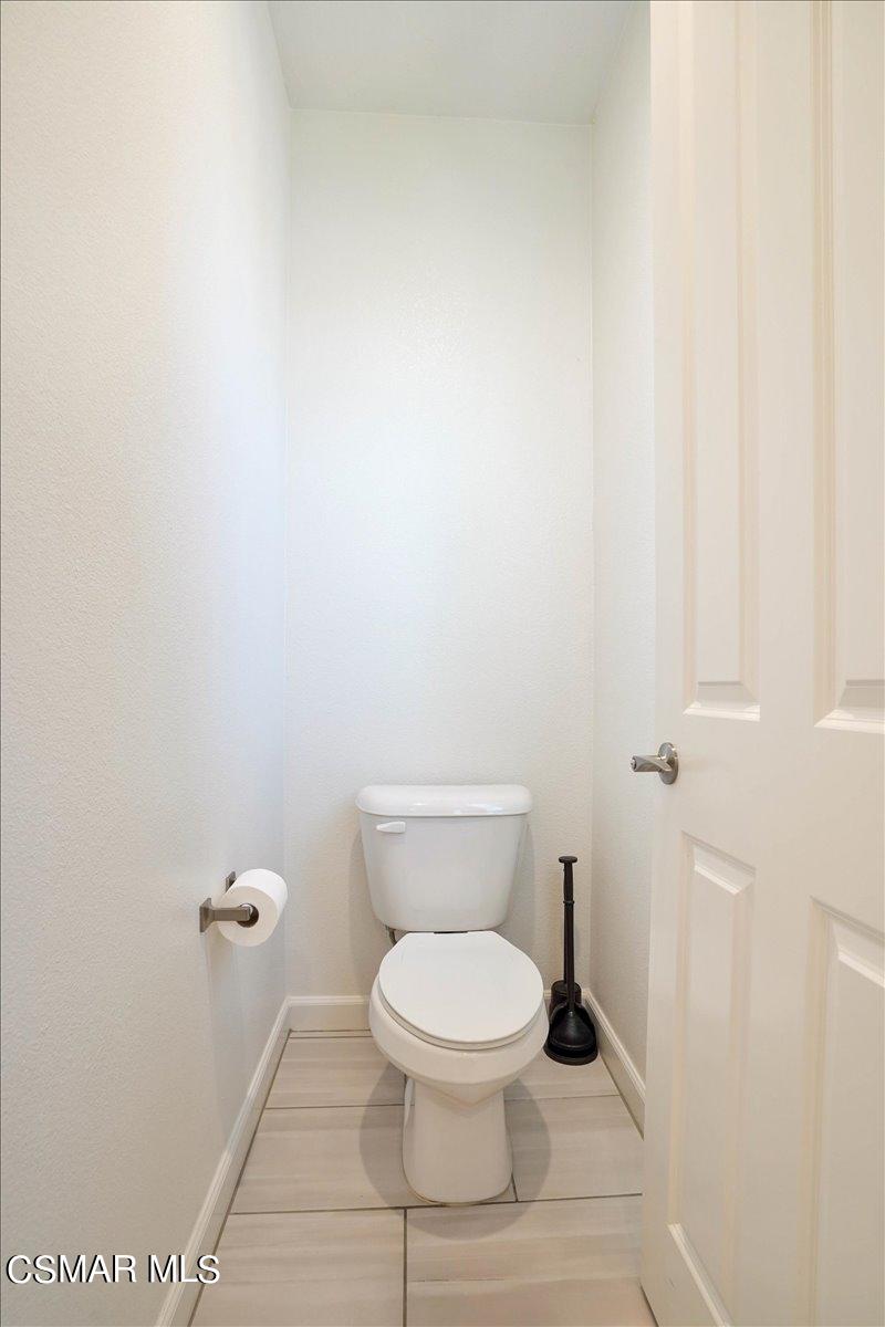 1643 Range Road Oxnard, CA 93036 - Photo 22 of 31 a white toilet sitting next to a white wall