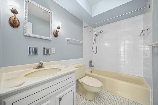 a bathroom with a sink a toilet and a bathtub