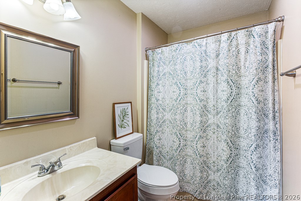 461 Lands End Road Fayetteville, NC 28314 - Photo 25 of 31 a bathroom with a sink toilet and shower