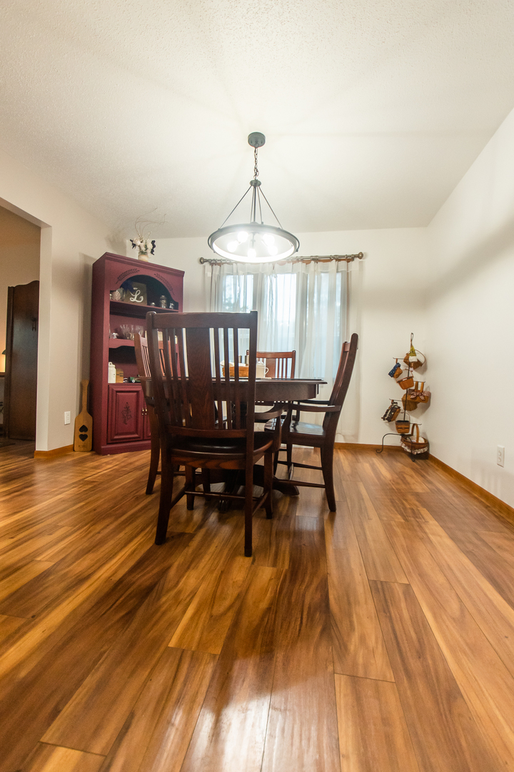 2235 Center Lane Dixon, IL 61021 - Photo 11 of 51 a dining room with furniture window and wooden floor