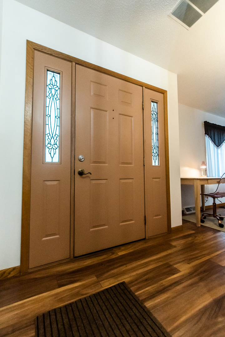 2235 Center Lane Dixon, IL 61021 - Photo 15 of 51 an empty room with wooden floor and a window