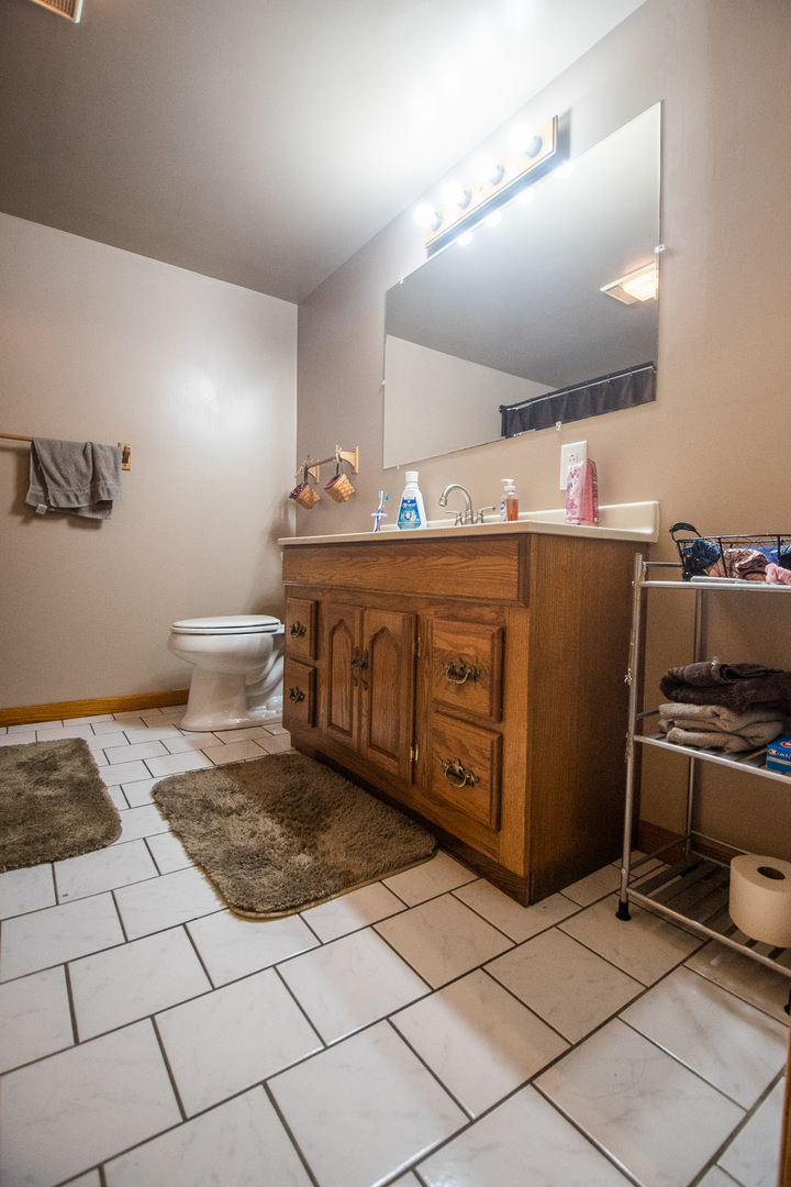 2235 Center Lane Dixon, IL 61021 - Photo 28 of 51 a spacious bathroom with a sink and a mirror
