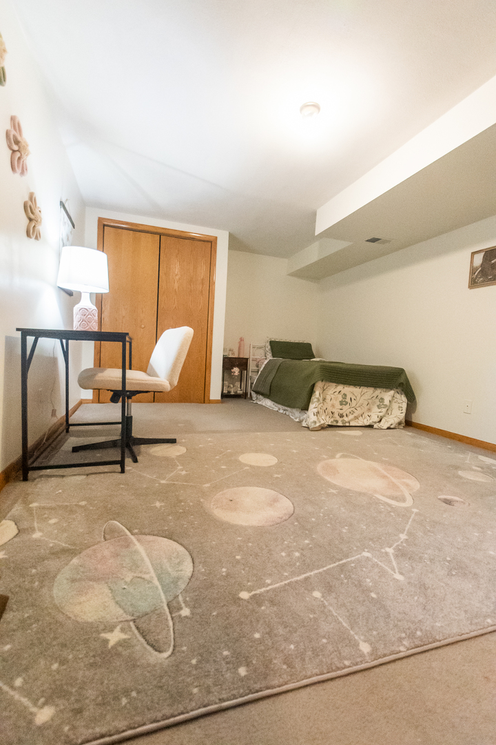 2235 Center Lane Dixon, IL 61021 - Photo 34 of 51 a bedroom with a bed and lamp with the potted plants