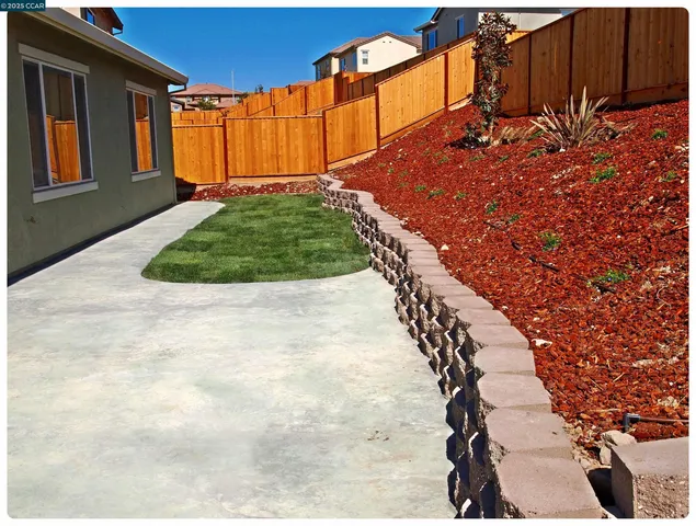 a view of a backyard with of a house