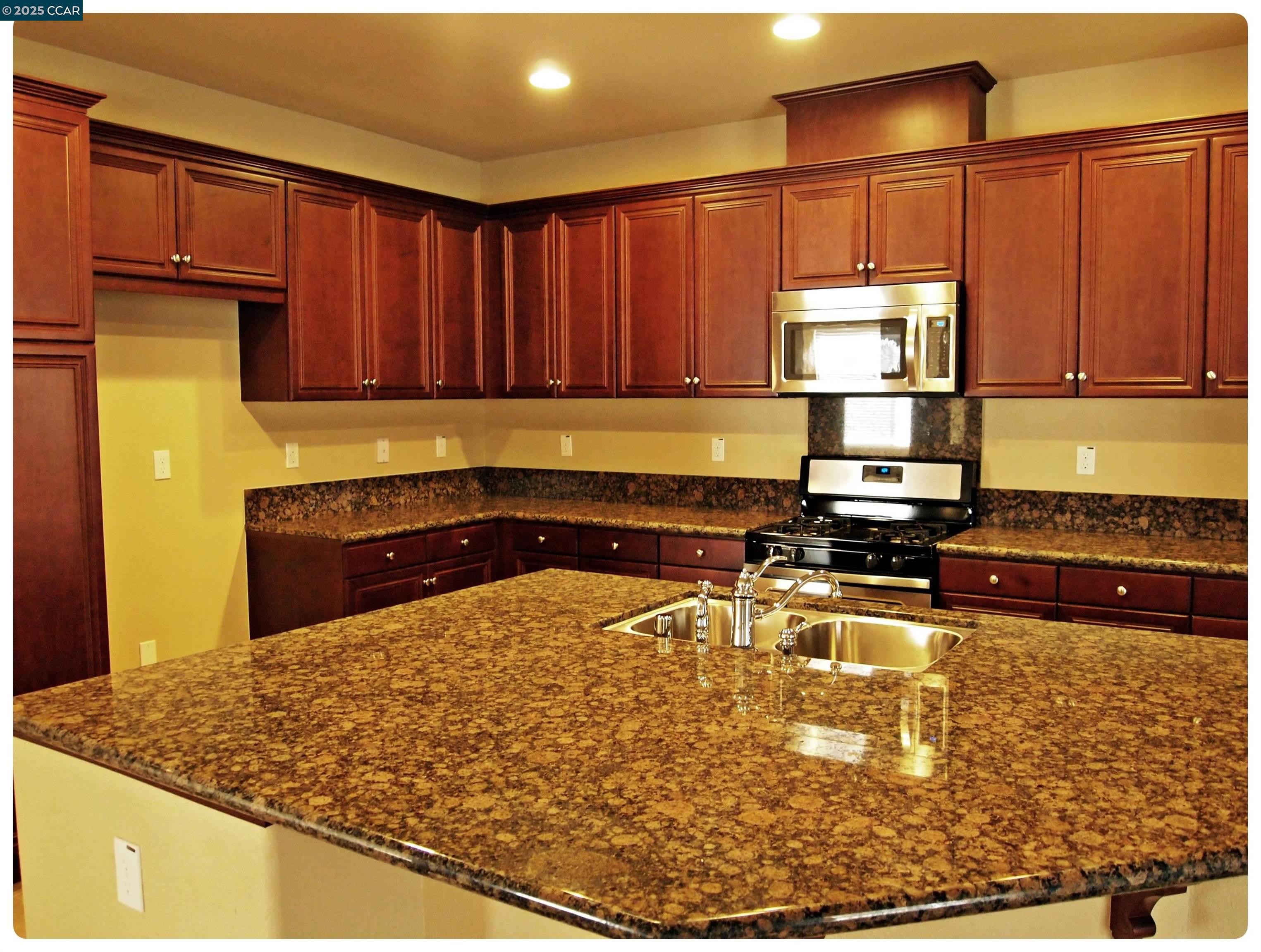 5603 Ventry Way Antioch, CA 94531 - Photo 4 of 19 a kitchen with a refrigerator and a stove top oven