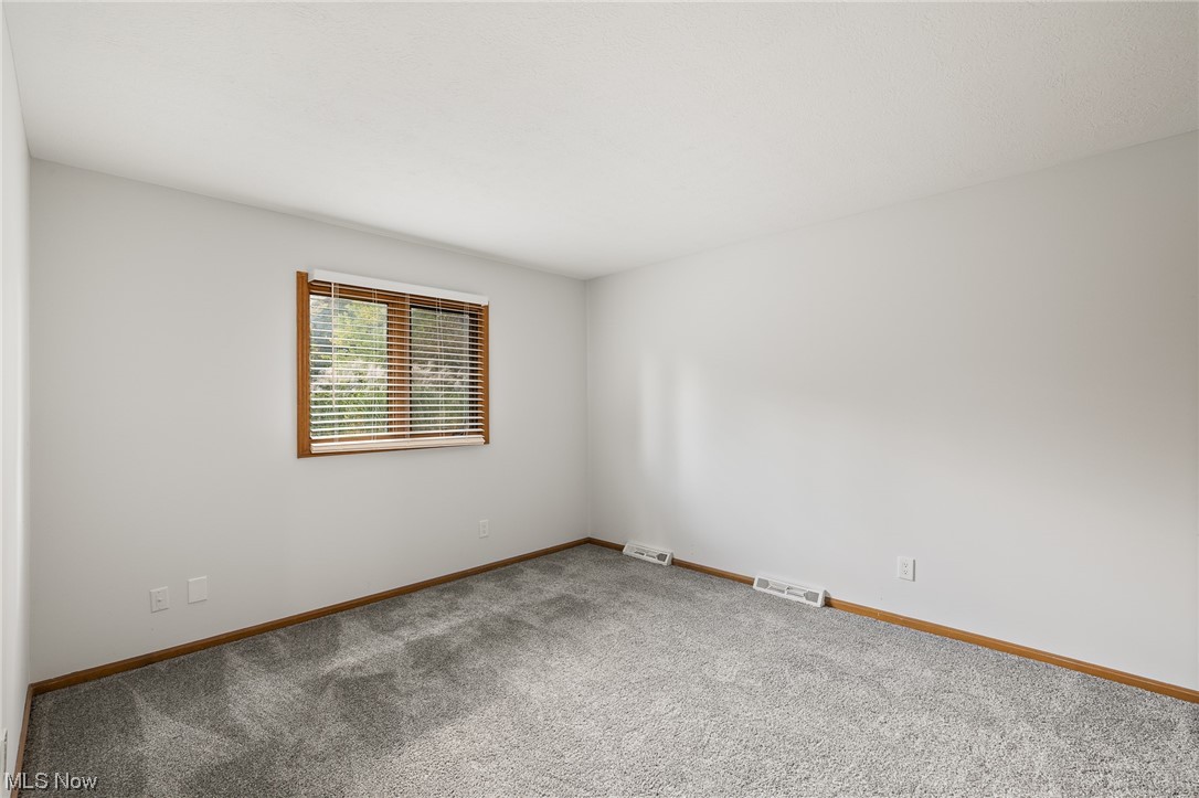 14495 Sheldon Road Cleveland, OH 44130 - Photo 17 of 27 View of carpeted empty room