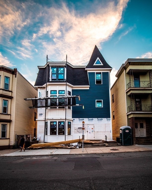 360 Meridian Street, Unit 3 Boston, MA 02128 - Photo 1 of 7 a front view of a house with a yard