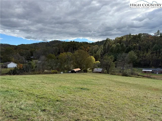 a view of a lake with a yard