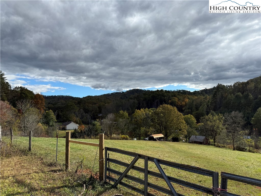 49 Loggy Hollow Road Bakersville, NC 28705 - Photo 17 of 17 a view of a lake with a mountain in the background