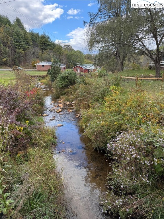 49 Loggy Hollow Road Bakersville, NC 28705 - Photo 3 of 17 a view of a lake view with lots of trees