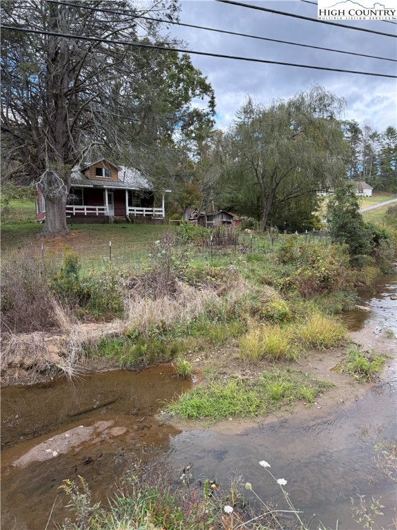 49 Loggy Hollow Road Bakersville, NC 28705 - Photo 4 of 17 a backyard of a house with lots of green space