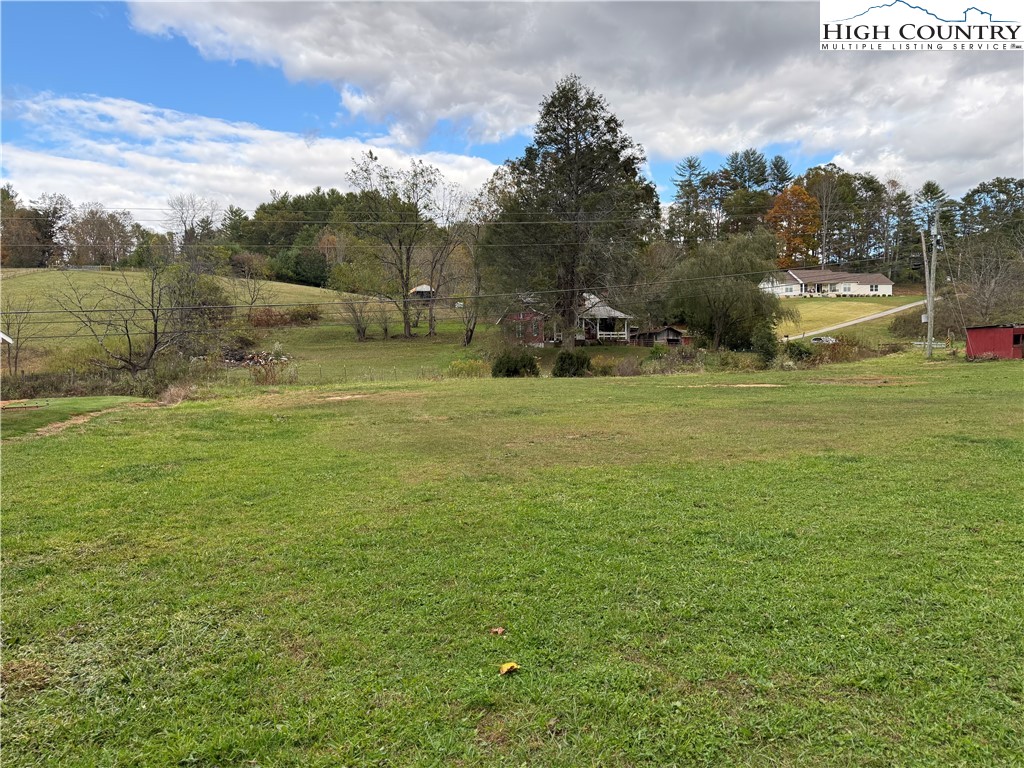 49 Loggy Hollow Road Bakersville, NC 28705 - Photo 5 of 17 a view of a field with an trees in the background