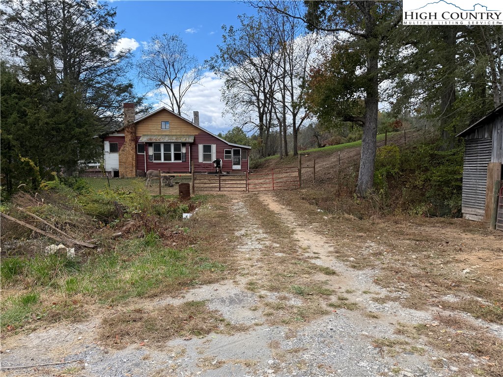 49 Loggy Hollow Road Bakersville, NC 28705 - Photo 7 of 17 a front view of a house with a yard